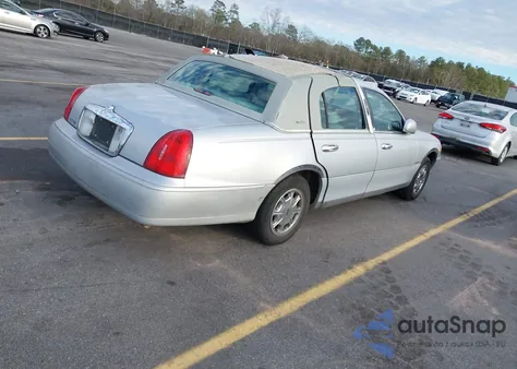 1998 Lincoln Town Car Signature из США, поврежденный, VIN 1LNFM82W3WY673210